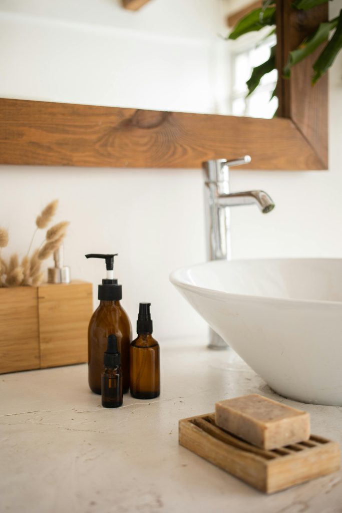 A serene bathroom scene featuring skincare products, a soap dish, and a stylish basin.